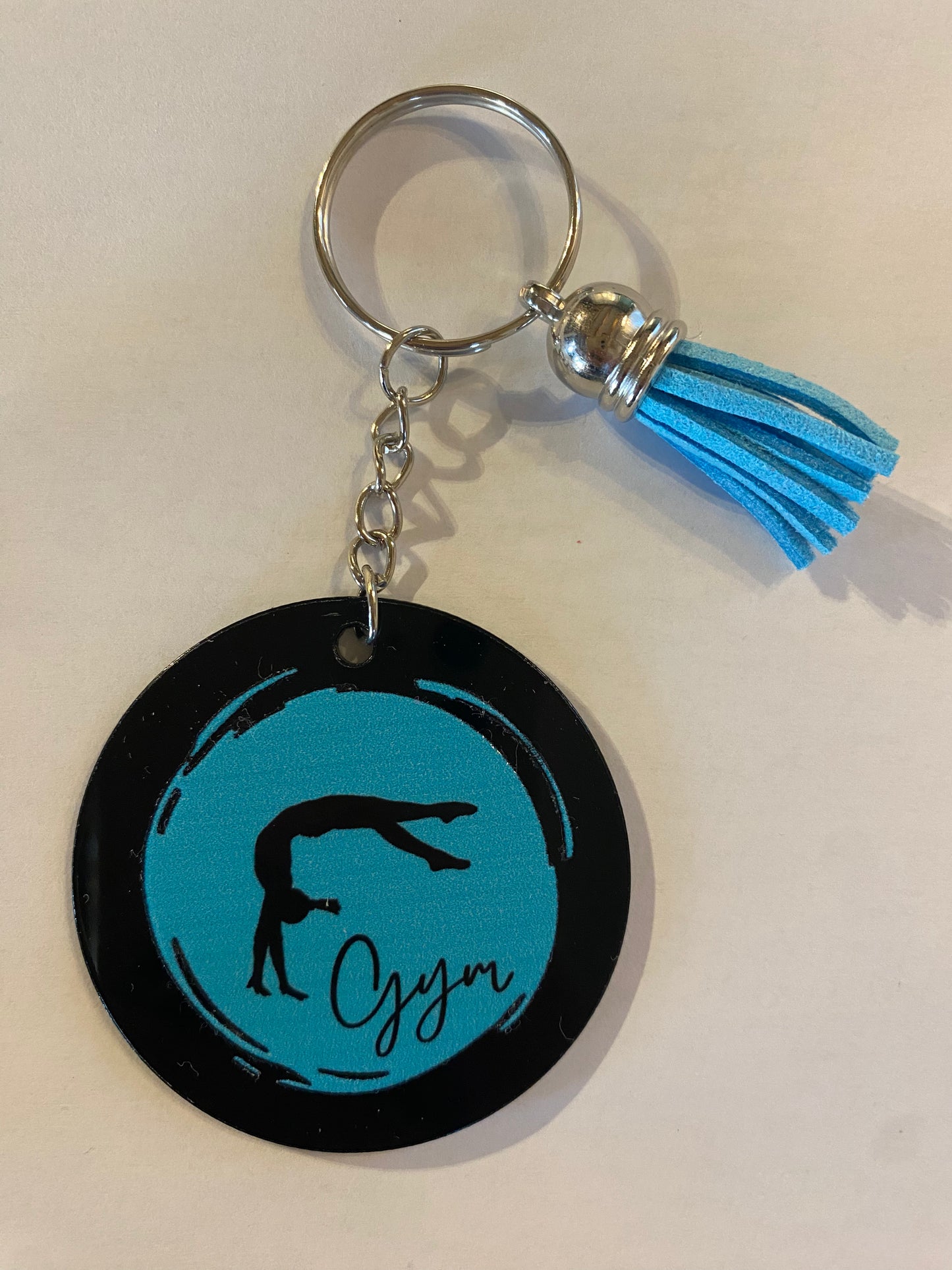 Porte clé / Déco de sac GYM rond noir modèle rond pastel