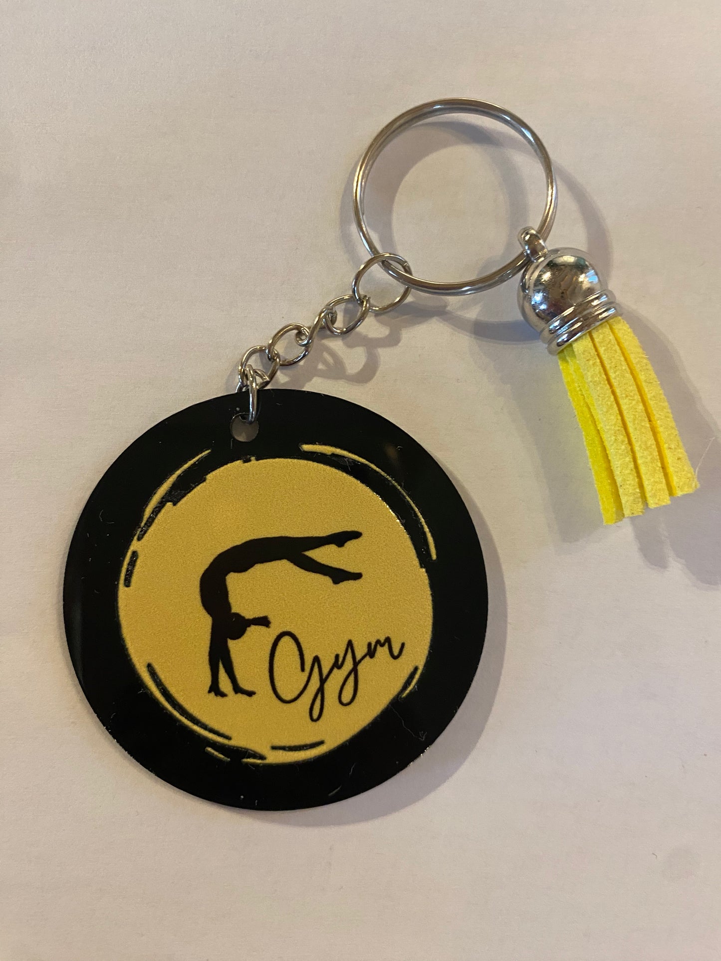 Porte clé / Déco de sac GYM rond noir modèle rond pastel