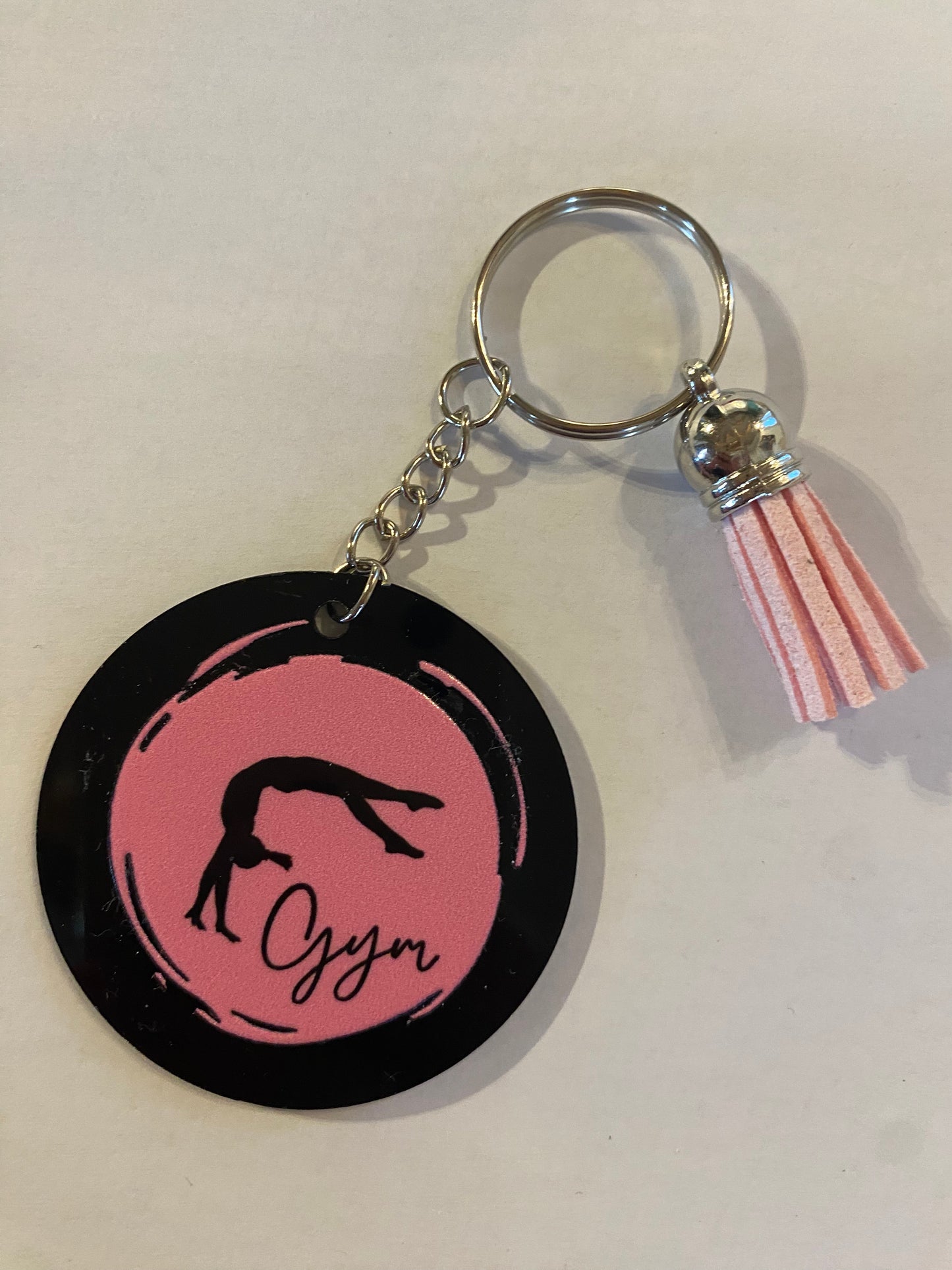 Porte clé / Déco de sac GYM rond noir modèle rond pastel