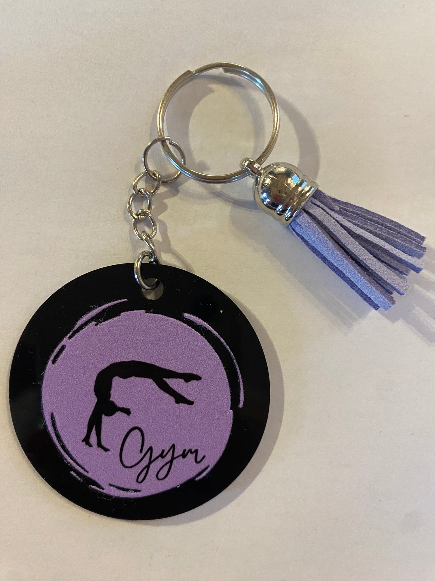 Porte clé / Déco de sac GYM rond noir modèle rond pastel