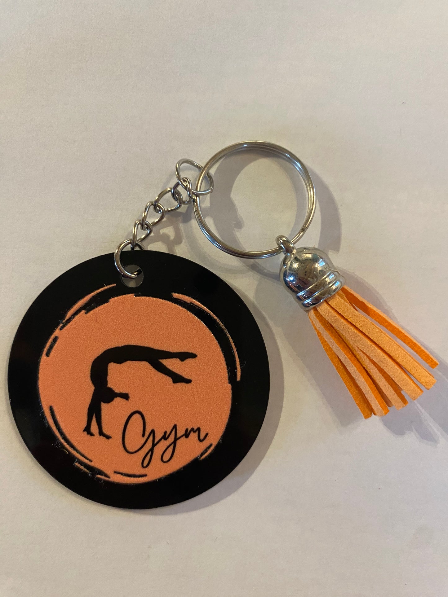 Porte clé / Déco de sac GYM rond noir modèle rond pastel